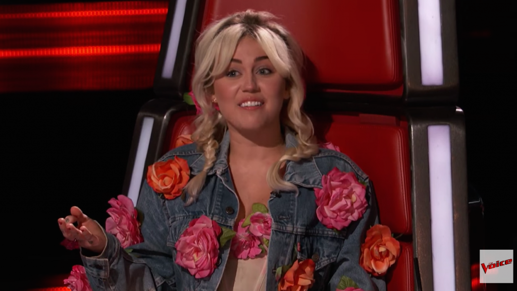 Miley Cyrus in a Red Chair