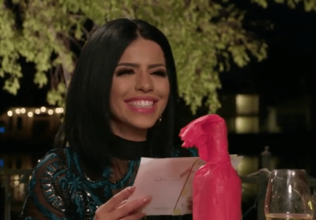 Larissa Lima Smiles at a Card