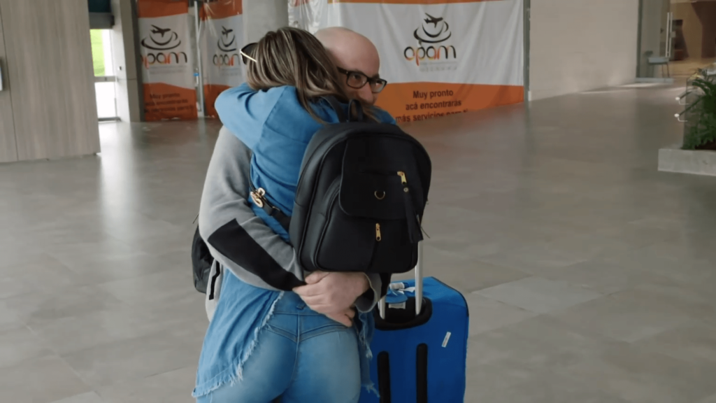 Mike Berk embraces Ximena Cuellar