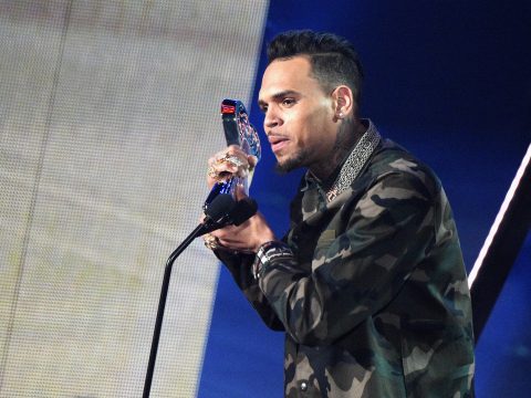 Chris Brown Accepts Award in Front of Crowd