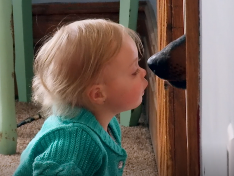 Novalee Baltierra Kisses Dog