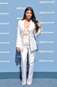 Kourtney Kardashian in a White Pantsuit Photo