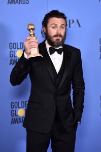 Casey Affleck with an Award