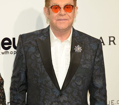 Elton John Has Red Shades