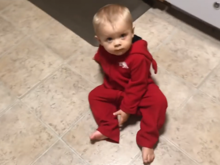 Samuel Dillard in a Onesie on the Floor