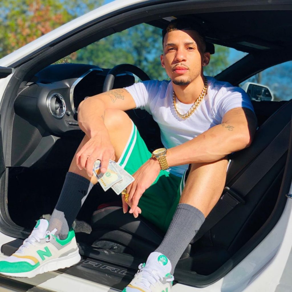 Martell Derouen sideways in a car - The Hollywood Gossip