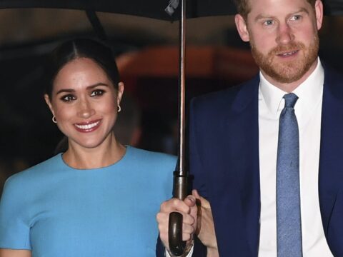 Meghan Markle and Prince Harry Under an Umbrella