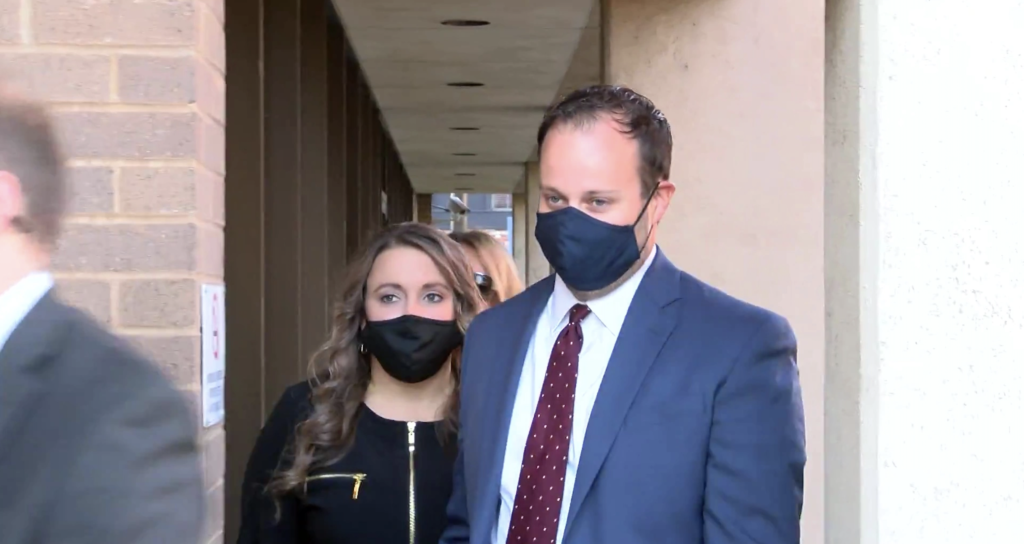 Josh Duggar leaves an Arkansas courtroom with his wife Anna.