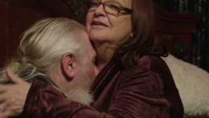 Debbie Johnson and Tony Starcevich embrace intimately at his Canadian home.
