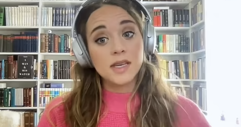 Jinger Duggar with headphones on YouTube.