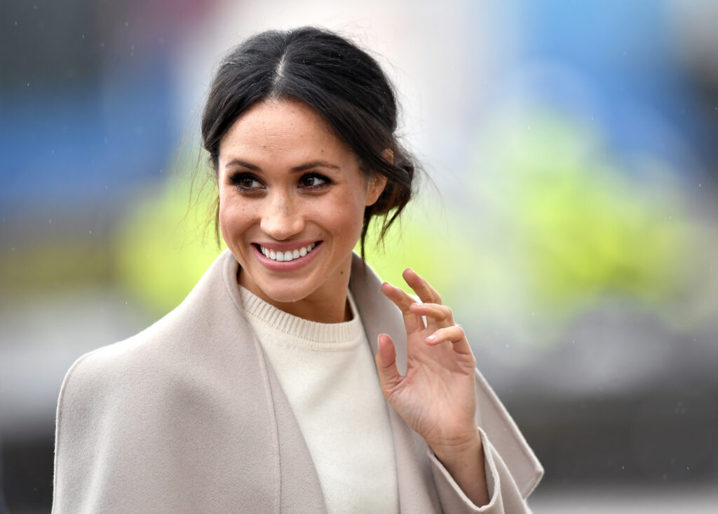 Meghan Markle greets reporters in Belfast.