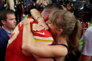 Taylor Swift embraces Travis Kelce after his Super Bowl win in 2024.