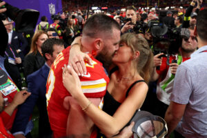 Taylor Swift and Travis Kelce kiss after the 2024 Super Bowl on February 11.