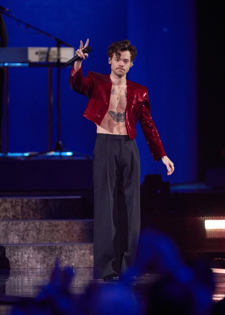 Harry Styles flaunts his torso on stage in February of 2023.