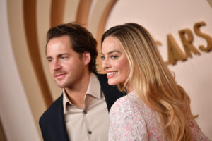 Tom Ackerley and Margot Robbie attend the Oscar Nominees Luncheon at the Beverly Hilton in Beverly Hills, California, on February 12, 2024.