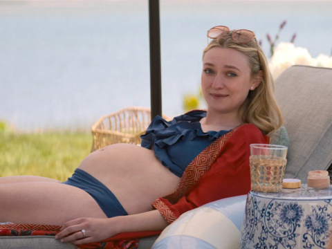 Dakota Fanning cradles her pregnant baby bump in The Perfect Couple. It was a prosthetic.