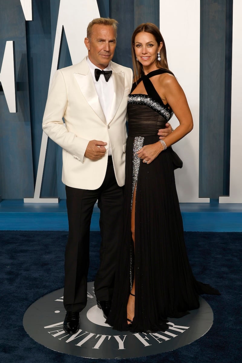 Kevin Costner and Christine Baumgartner attend the 2022 Vanity Fair Oscar Party