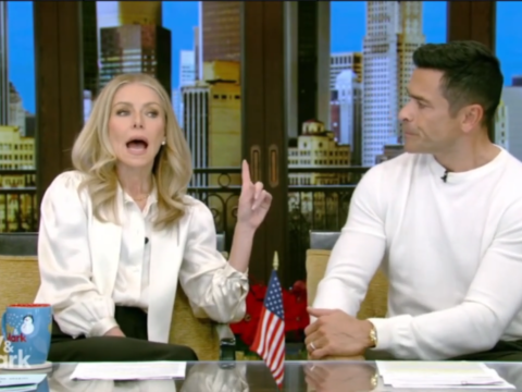 Mark Consuelos listens as Kelly Ripa speaks on Live with Kelly and Mark.