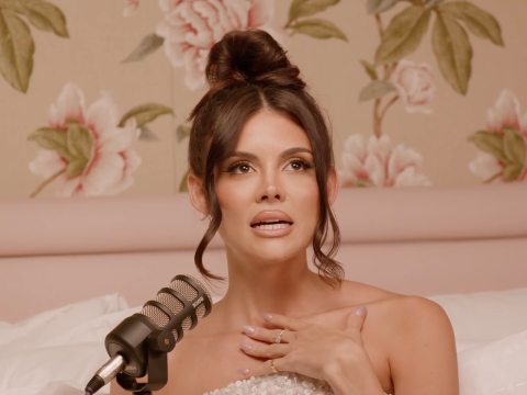 Holly Scarfone in bed on her podcast.