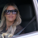 Christina Haack wears sunglasses in the car.