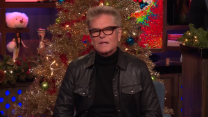 Harry Hamlin on Watch What Happens Live, with WWHL's holiday decor behind him.