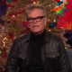 Harry Hamlin on Watch What Happens Live, with WWHL's holiday decor behind him.