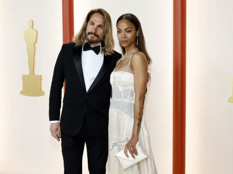 Marco Perego and Zoe Saldana attend the 95th Annual Academy Awards on March 12, 2023 in Hollywood, California.