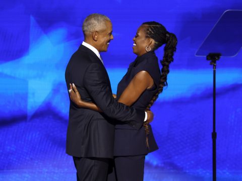 Former U.S. President Barack Obama greets former first lady Michelle Obama as he arrives to speak on stage during the second day of the Democratic National Convention at the United Center on August 20, 2024 in Chicago, Illinois.