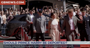 Prince Harry and Meghan Markle greet a crowd of supporters.
