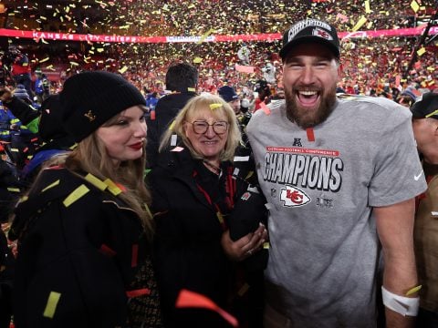 Travis Kelce #87 of the Kansas City Chiefs celebrates with Taylor Swift and mother Donna Kelce after the Chiefs defeated the Buffalo Bills 32-29 to win the AFC Championship Game at GEHA Field at Arrowhead Stadium on January 26, 2025 in Kansas City, Missouri.