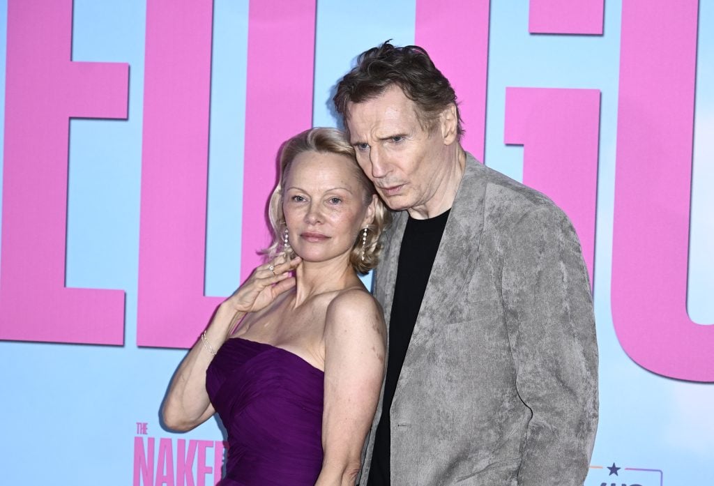Liam Neeson and Pamela Anderson cozy up on the red carpet.