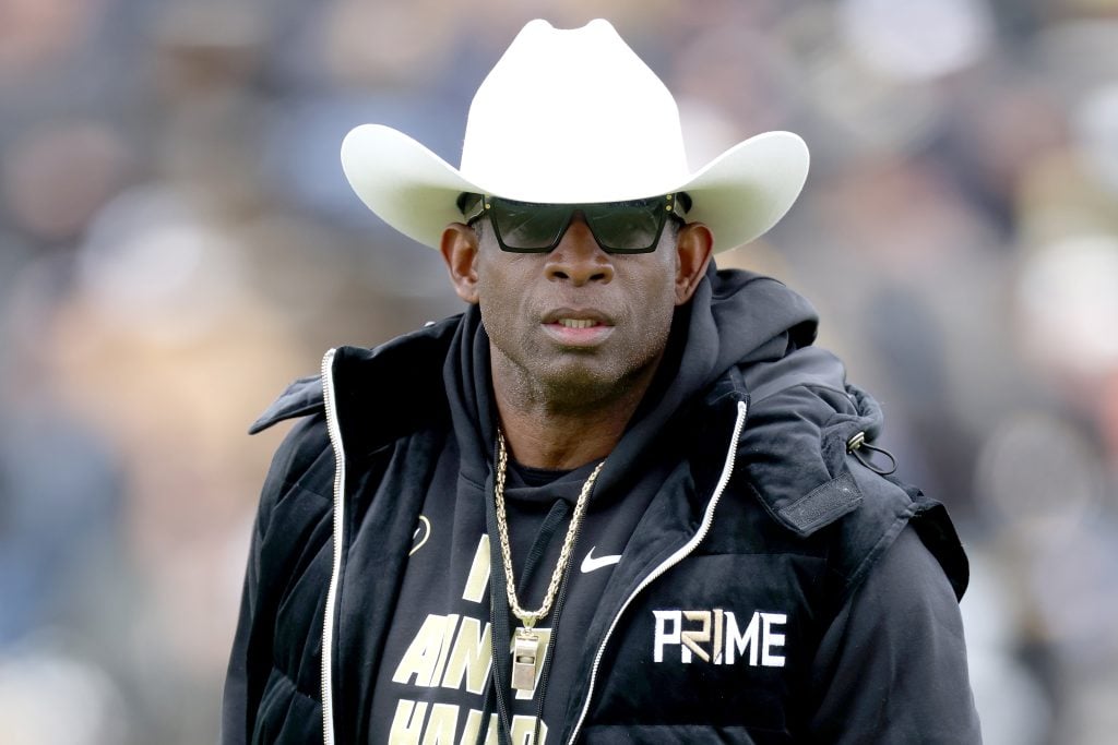 Head coach Deion Sanders of the Colorado Buffaloes watches as his team warms up prior to their spring game at Folsom Field on April 22, 2023 in Boulder, Colorado.