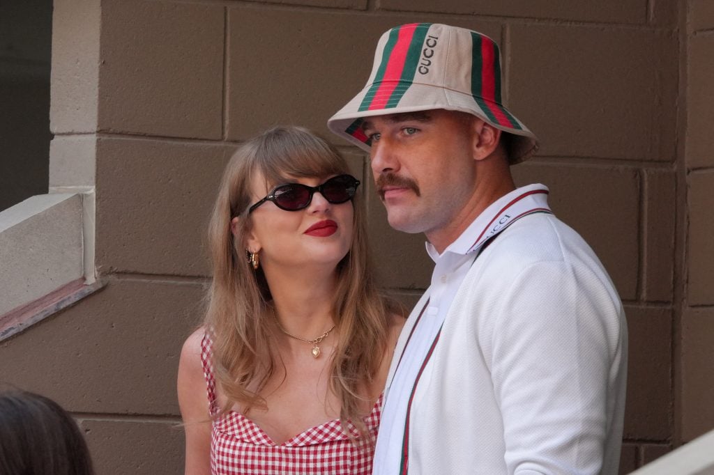 US musician Taylor Swift and US NFL football player Travis Kelce attend the men's final match between Italy's Jannik Sinner and USA's Taylor Fritz on day fourteen of the US Open tennis tournament at the USTA Billie Jean King National Tennis Center in New York City, on September 8, 2024. 