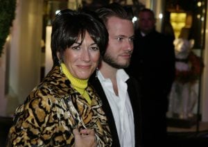 Ghislane Maxwell with an unidentified male companion attends the Opening of the Asprey Flagship Store on 5th Avenue December 8, 2003 in New York City.