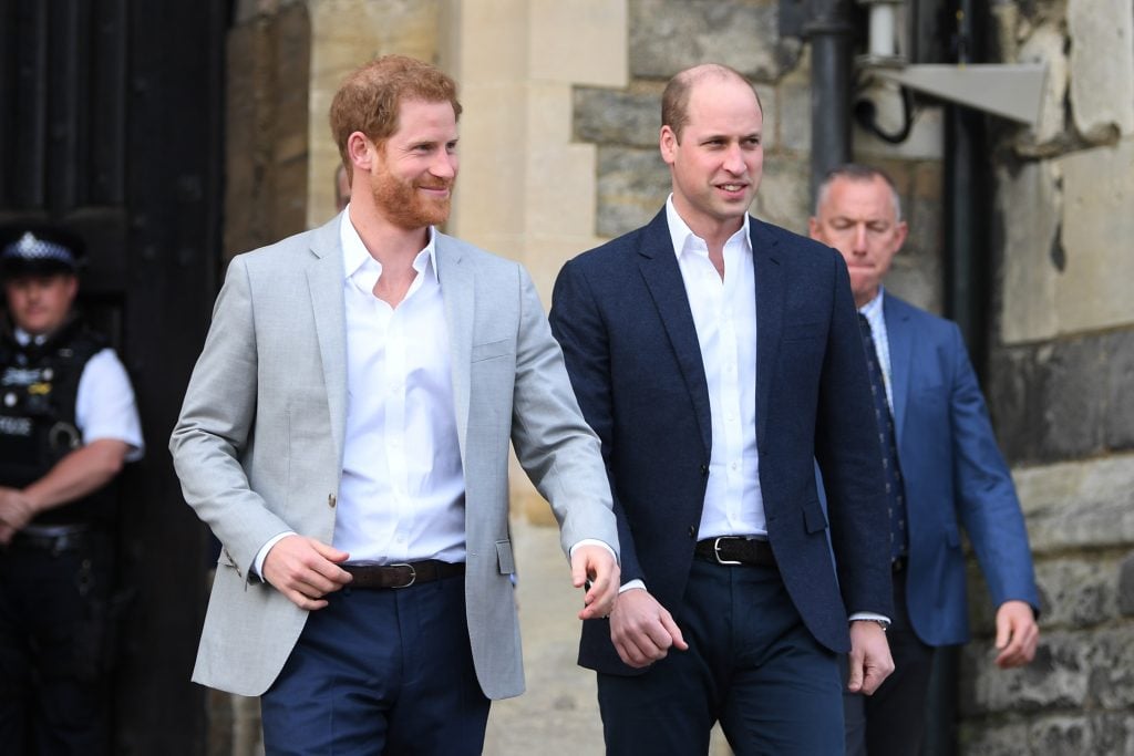 Prince Harry and Prince William, Duke of Cambridge embark on a walkabout ahead of the royal wedding of Prince Harry and Meghan Markle on May 18, 2018 in Windsor, England.
