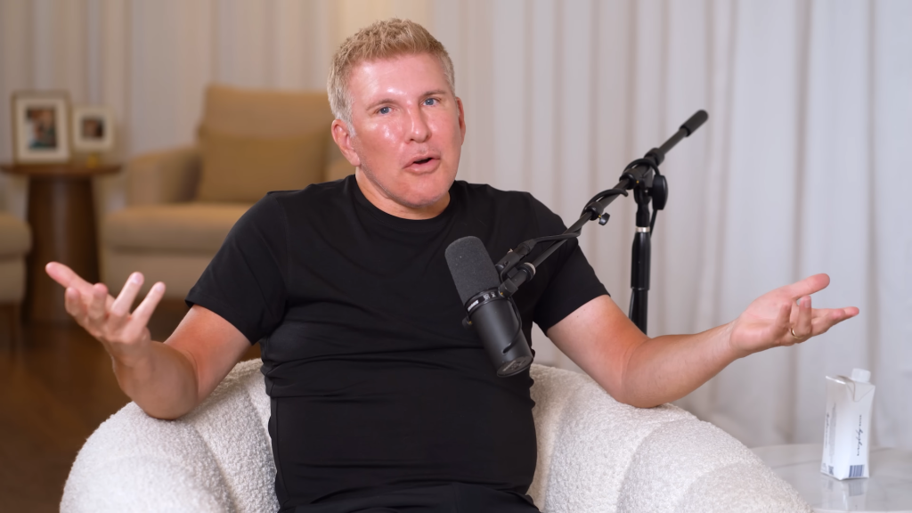 Todd Chrisley shrugs dramatically on his podcast.