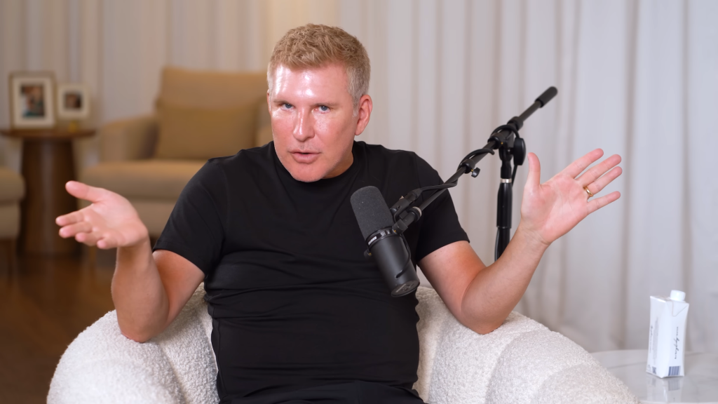 Todd Chrisley gestures dramatically on his podcast.