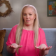 June Shannon in a pink blouse.
