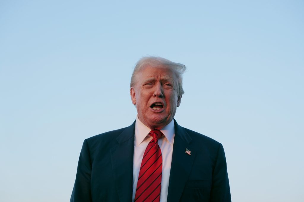 Donald Trump yells outdoors on August 3, 2025.