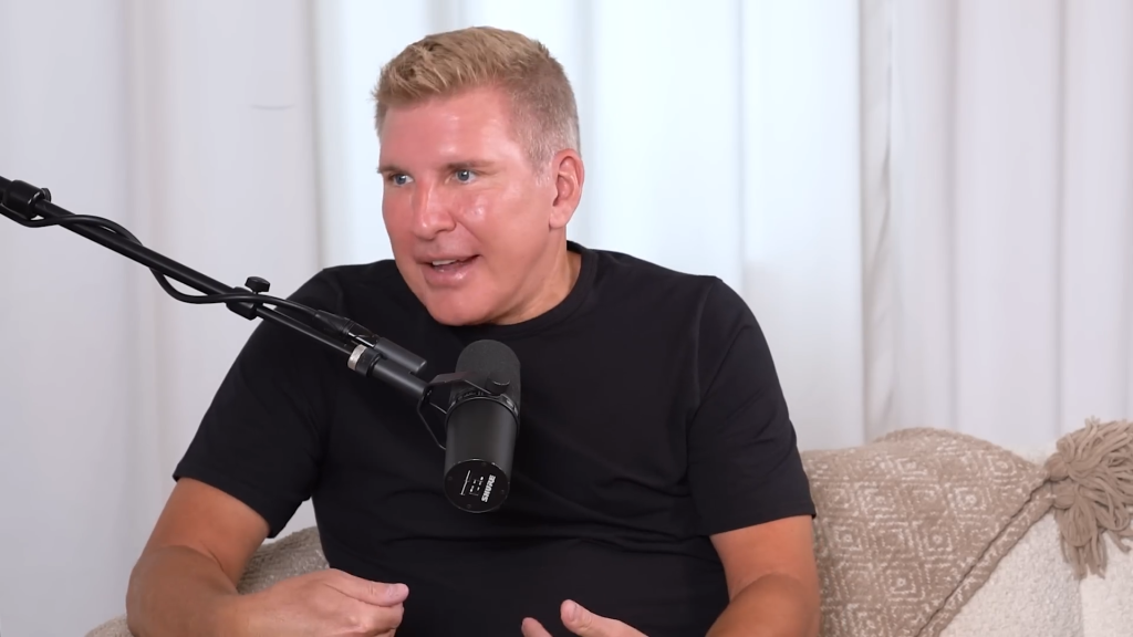 Todd Chrisley faces the side and speaks.
