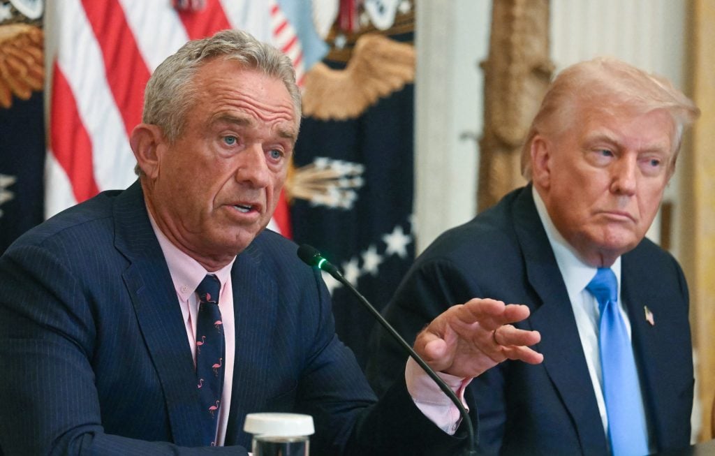 Donald Trump sits beside RFK Jr. on July 30, 2025.