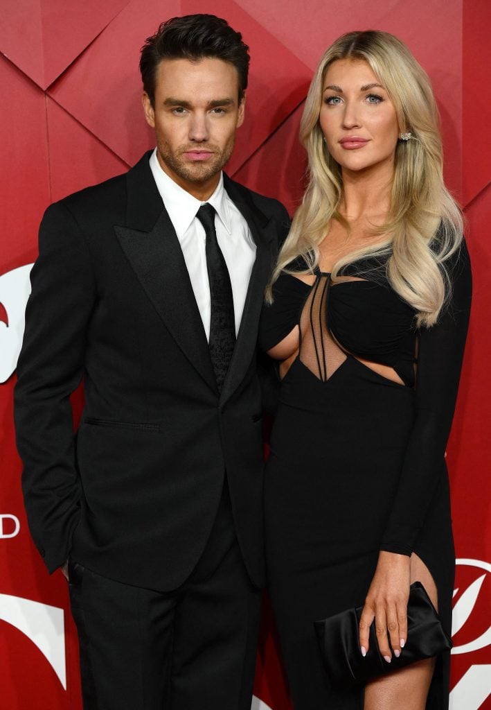 English singer Liam Payne and US actor Katie Cassidy pose on the red carpet upon arrival at The 2022 Fashion Awards in London on December 5, 2022.