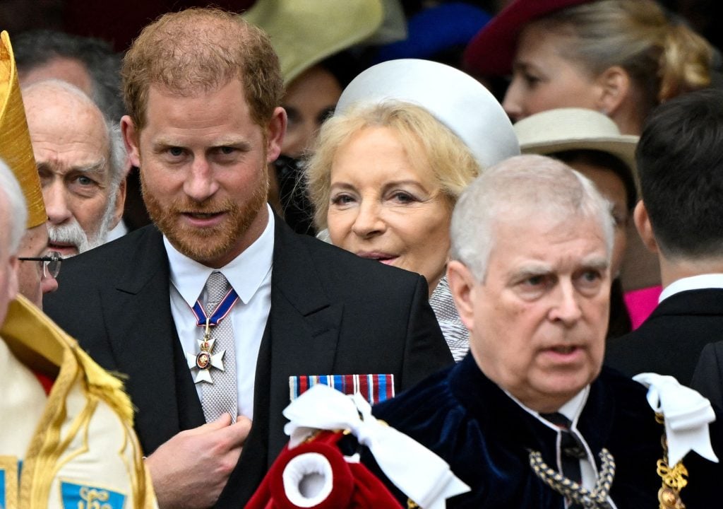 Britain's Prince Harry, Duke of Sussex and Britain's Prince Andrew, Duke of York leave after attending the coronations of Britain's King Charles III and Britain's Camilla, Queen Consort, at Westminster Abbey in central London on May 6, 2023.