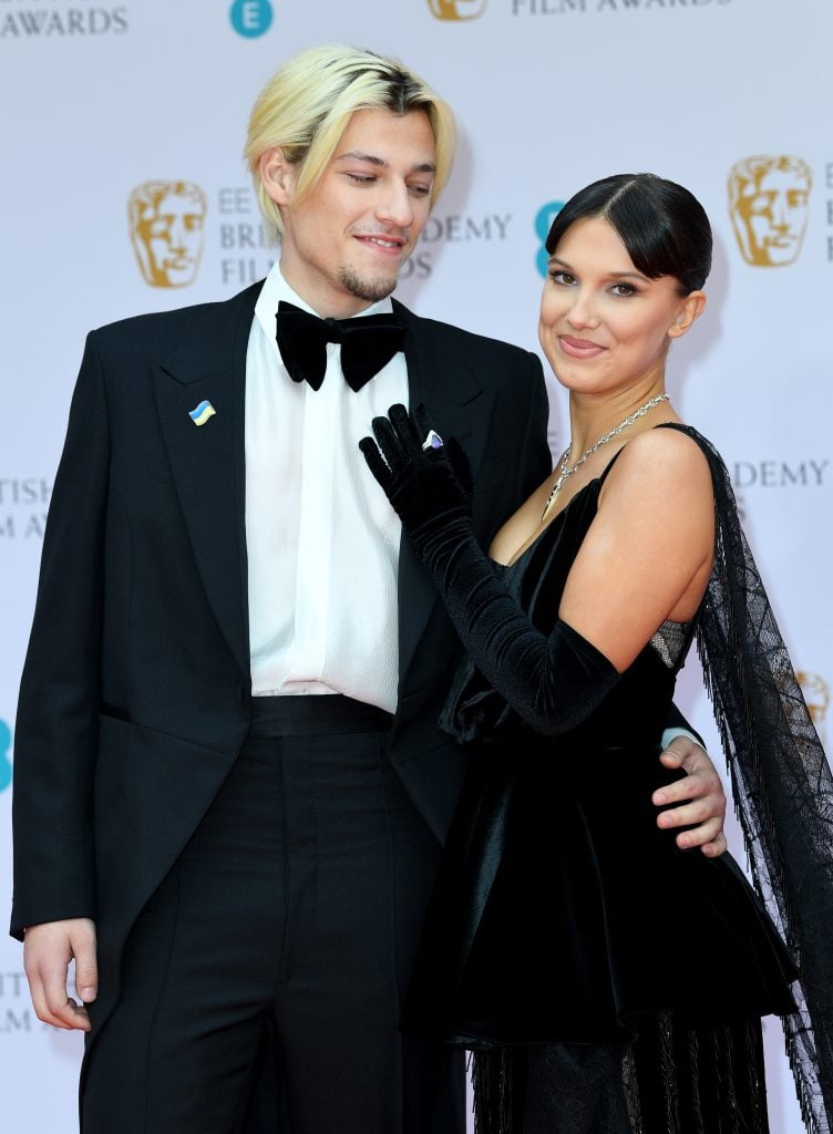Jake Bongiovi and Millie Bobby Brown attend the EE British Academy Film Awards 2022 at Royal Albert Hall on March 13, 2022 in London, England. 