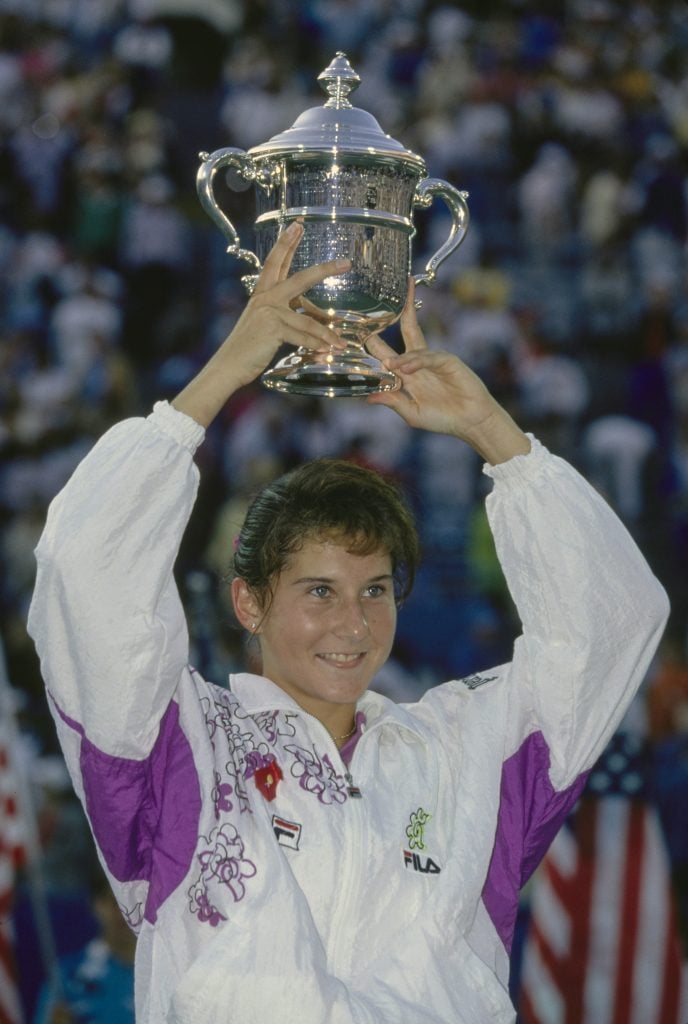 Monica Seles from Yugoslavia holds the trophy aloft to clebrate winning the Women's Singles Final match of the US Open Tennis Championship against Arantxa Sánchez Vicario on 12th September 1992 at the USTA National Tennis Center in New York City, New York, United States.