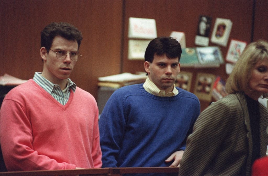 Erik Menendez (L) and his brother Lyle (R) listen during a pre-trial hearing, on December 29, 1992 in Los Angeles after the two pleaded innocent in the August 1989 shotgun deaths of their wealthy parents, Jose and Mary Louise Menendez of Beverly Hills, Calif. 