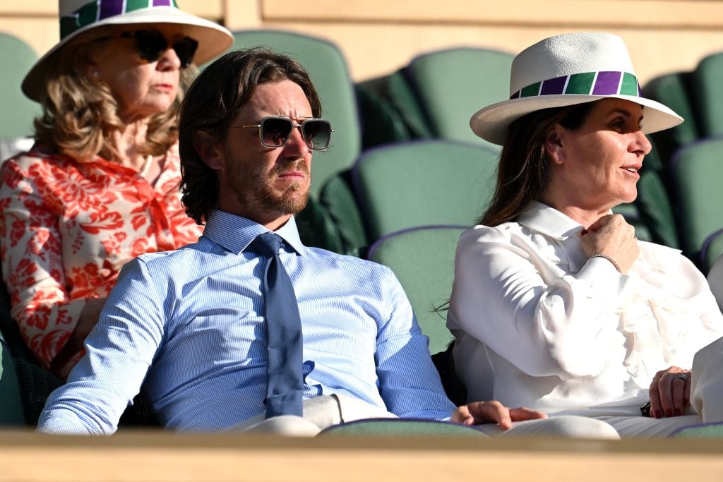 Golfer Tommy Fleetwood (L) and wife Clare Fleetwood look on from the Royal Box during the Men's Singles second round match between Andy Murray of Great Britain and Stefanos Tsitsipas of Greece during day five of The Championships Wimbledon 2023 at All England Lawn Tennis and Croquet Club on July 07, 2023 in London, England.