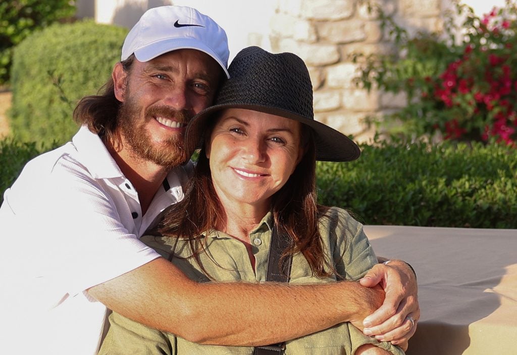 Tommy Fleetwood of England poses with his wife Clare Fleetwood after his third round of the Dubai Invitational at Dubai Creek Golf and Yacht Club on January 13, 2024 in Dubai, United Arab Emirates.