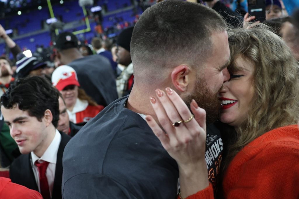 Travis Kelce #87 of the Kansas City Chiefs embraces Taylor Swift after a 17-10 victory against the Baltimore Ravens in the AFC Championship Game at M&T Bank Stadium on January 28, 2024 in Baltimore, Maryland.