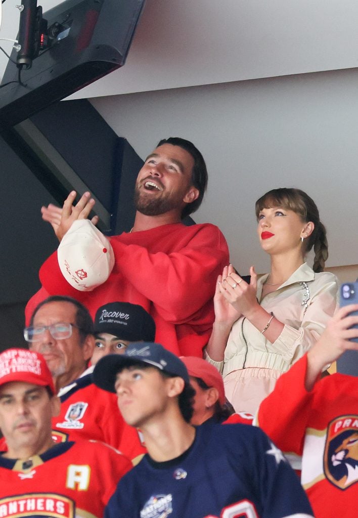Travis Kelce, left, and Taylor Swift react as the Edmonton Oilers and the Florida Panthers play during the first period in Game Four of the 2025 Stanley Cup Final at Amerant Bank Arena on June 12, 2025 in Sunrise, Florida.